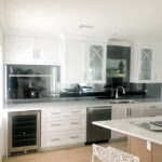 Kitchen with Mirror backsplash for illuminating purposes