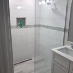 shower glass enclosure without a door installed.